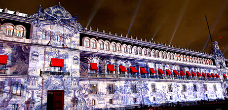 a photo of an huge building on the Plaza del Zocalo of Mexico City during the video mapping show in 2009 